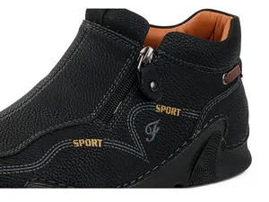 Close-up of black high-top leather shoes featuring side zipper and SPORT embroidery