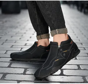 Detailed side view of black high-top leather casual shoes with zipper and sport print