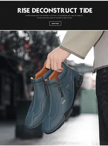 Detailed close-up of blue high-top leather shoes with side zipper and sport logo