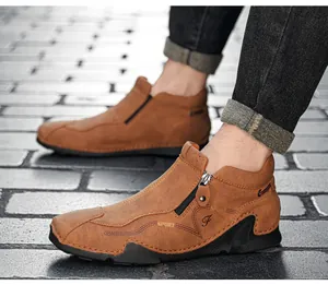 Close-up of brown leather high-top shoes with side zipper and stylish sport design.
