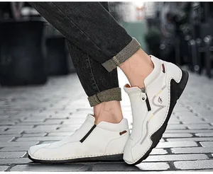 Side profile detail of white leather high-top sports shoes with zipper and sport logo