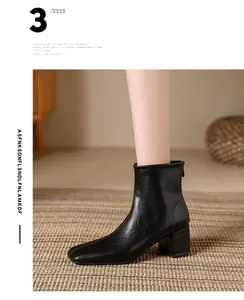 Detailed side view of black square-toe Chelsea ankle boot featuring a sturdy block heel