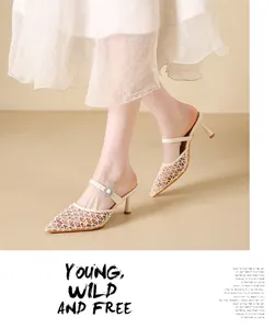 Elegant cream mesh mule sandals featuring a sparkling buckle and sleek thin high heels