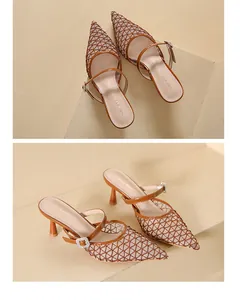 Close-up detail of vintage mesh pointed toe high heel mules with elegant buckle strap