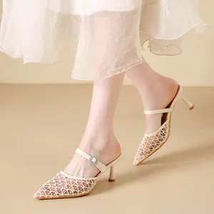 Vintage cream mesh pointed-toe mules with kitten heels for summer outfits.