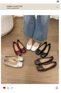 Various colors of French style bow ballet flats displayed on a wooden floor setting