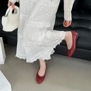 Red ballet flats with bow detail and soft leather finish in Korean style for women.