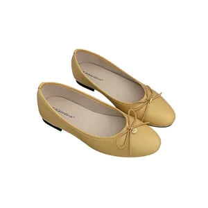 Elegant beige women's ballet flats with round toe and a delicate bow knot detail