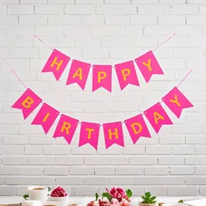 Close-up detail of pink swallowtail bunting with gold Happy Birthday letters