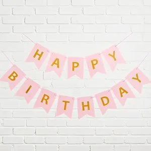 Close-up of pink swallowtail bunting with gold foil 'Happy Birthday' letters