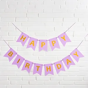 Close-up detail of the purple swallowtail birthday banner with elegant gold foil letters.