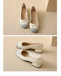 Elegant off-white women's low heel shoes with silver glitter toe and delicate bow detail