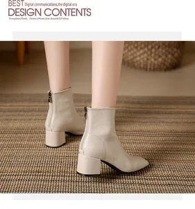 Detail showing the back view of beige square-toe ankle boots with chunky heels and zipper.