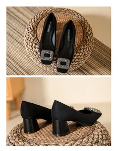 Close-up detail of black suede square toe pumps with chunky heel and crystal buckle