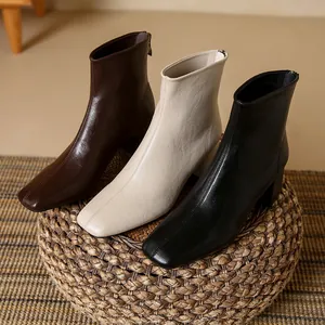 Elegant square toe women's ankle boots with chunky heels in brown, beige, and black.