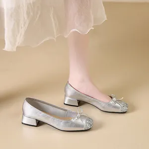Elegant silver square toe Mary Jane shoes featuring glitter toe cap and bow detail