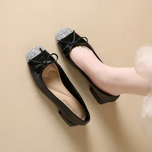 French style black Mary Jane shoes with silver glitter square toe and bow detail.