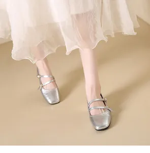 Elegant silver metallic square toe Mary Jane shoes styled with a sheer white dress