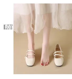 Close-up of ballet-style cream Mary Jane shoes featuring a square toe and double straps.