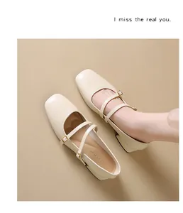 Close-up detail of cream ballet Mary Jane shoes with square toe and double straps