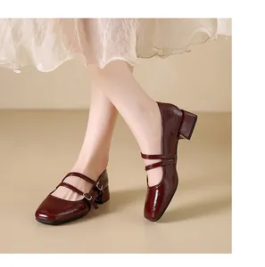 Elegant burgundy patent leather Mary Jane shoes featuring a square toe and double straps