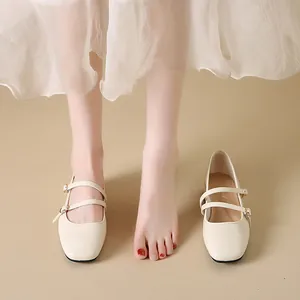 Cream square-toe ballet Mary Jane shoes with double straps and low block heel.