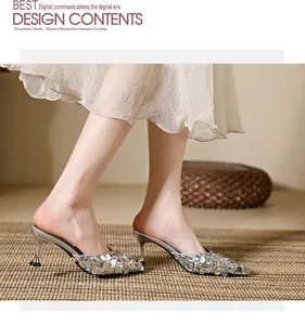 Elegant silver sequined pointed-toe kitten heel mules shown in a lifestyle setting