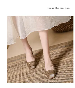 Detailed macro view of elegant square-toe satin pumps with metal buckle and soft sheen.