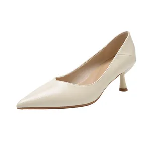 Elegant cream pointed-toe pumps with soft leather texture and stylish kitten heels.