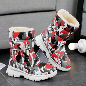Detailed view of camouflage pattern children's snow boots with plush fleece lining