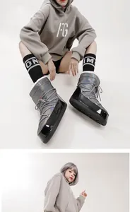 Stylish holographic winter moon boots with lace-up detail and glossy black trim.