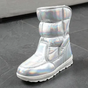 Detail shot of holographic iridescent snow boot with quilted padded design and white sole