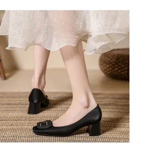 Elegant black satin block heel pumps featuring a stylish square buckle ornament detail