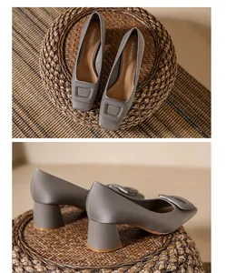 Detailed view of silver satin block heel pumps with elegant square toe buckle decoration