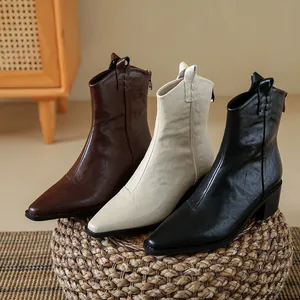 Bottines de cow-boy rétro pointues en cuir souple noir, blanc et marron pour femmes