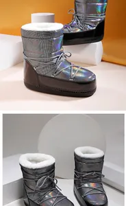 Close-up of holographic silver snow boots with warm faux fur lining and non-slip soles