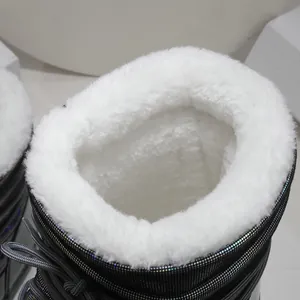 Detailed view of winter snow boots with thick white faux fur lining for extreme warmth
