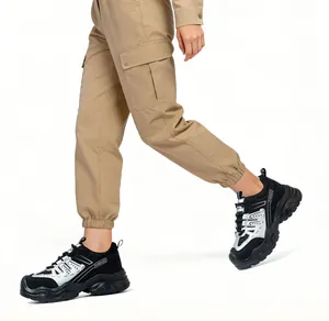 Action view of women's steel-toe safety shoes with breathable mesh and chunky soles