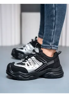 Detailed view of breathable women's steel toe safety shoes in black and silver finish.