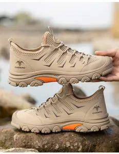 Detailed view of breathable khaki safety shoes with steel toe for construction work