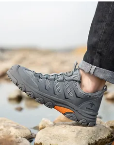 Detail shot of grey breathable safety work shoe with anti-smashing steel toe