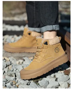 Detail view of brown winter safety work boots with warm fur lining and durable sole.