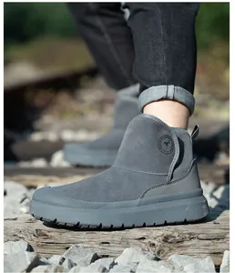 Side view detail of gray suede safety work boots with durable puncture-proof soles.