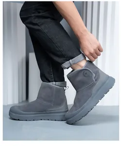 Side view detail of stylish grey suede work boots featuring thick slip-resistant soles.