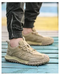 Detailed view of khaki breathable safety shoes for men with rugged non-slip soles