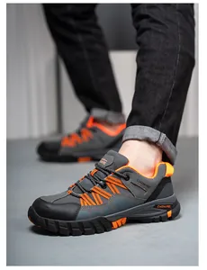 Detailed view of grey and orange breathable safety work shoes featuring anti-smashing sole