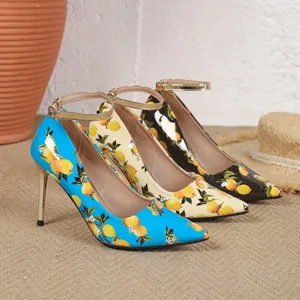 Three pairs of elegant pointed-toe lemon print stiletto pumps with gold straps