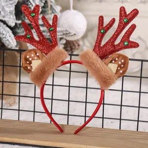 Detailed view of a festive red reindeer antler headband with glitter and fur
