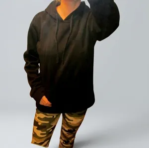 Detail showing the comfortable fit of a black casual hooded sweatshirt in a home setting