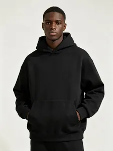 Detailed shot of a premium heavy fleece black oversized hoodie with a kangaroo pocket